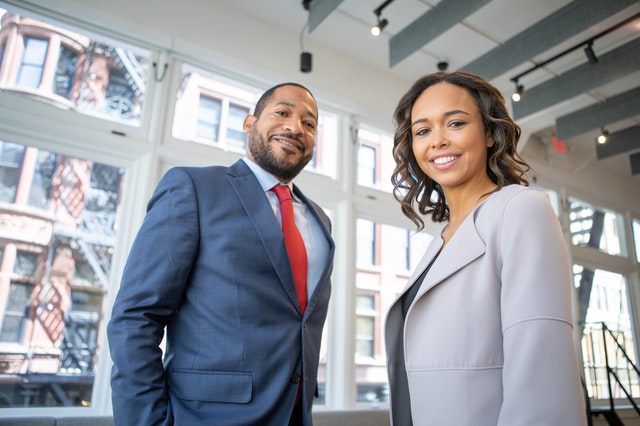 man and woman in suits